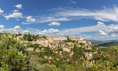 Fototapeta na wymiar Panoramic view of Gordes forest rock and old village on Luberon massif in French Prealps. Vaucluse, Provence, Alpes, Cote d'Azur, France