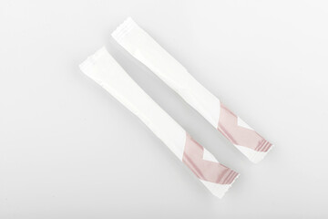 Sugar stick. Sugar in paper kraft packaging. Mock up for design isolated on white background