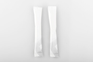 Sugar stick. Sugar in paper kraft packaging. Mock up for design isolated on white background