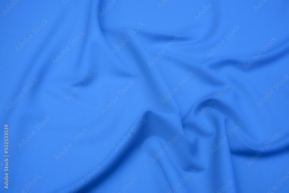Wall mural close-up texture of natural blue fabric or cloth in same color. fabric texture of natural cotton, si