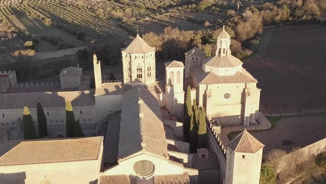 Aerial Royal Abbey of Santa Maria de Poblet Cistercian monastery At Sunset.