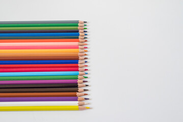Colored pencils isolated on white background.
Education, kindergarten concept. Idea of ​​pedagogy concept.view from the top.