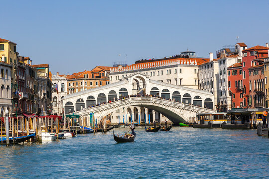 Venice Rialto bridge over Canal Grande with gondola travel traveling holidays vacation town in Italy © Markus Mainka