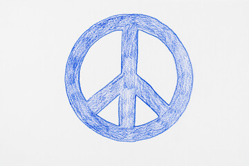 Peace symbol drawn by child with blue pencil