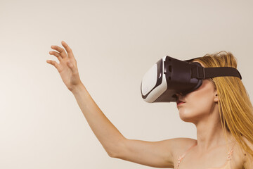 Girl wearing virtual reality goggles.