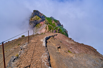 Mountain trek to the Pico Ruivo mountains from Pico Arieiro, highest mount, tropical nature, dangerous travel