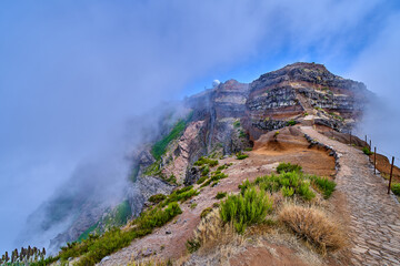 Mountain trek to the Pico Ruivo mountains from Pico Arieiro, highest mount, tropical nature, dangerous travel