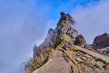 Mountain trek to the Pico Ruivo mountains from Pico Arieiro, highest mount, tropical nature, dangerous travel