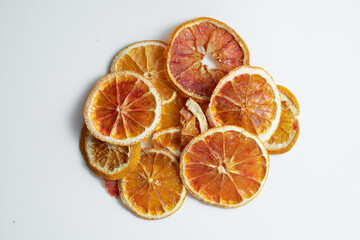 Natural Dried Oranges Slices Snack. Dried Oranges for baking. Dried grapefruit, slices and dried candie citrus fruit.  Isolated white background.