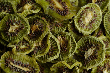 Close up of Natural Dried Kiwi Slices Snack. Dried Kiwi for baking.  Isolated white background.