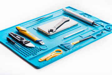 Flat lay image of dismantling the broken smart phone for preparing to repair or replace some components, Top view