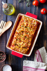 Cannelloni with meat, cheese, tomatoes and thyme. Italian cuisine.