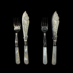 antique silver cutlery set of fork and knife with engraving. vintage cutlery for table setting on...