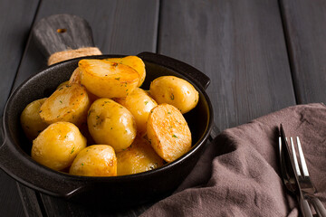 Fresh Cooked, new potatoes,with dill, on a wooden table, selective focus. close-up, toning, no people,