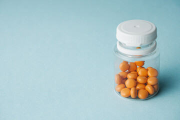 various medicines on a blue paper background