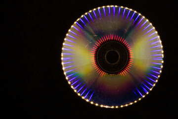 Reflection of light in a Compact Disk(CD) or Digital versatile disk(DVD).