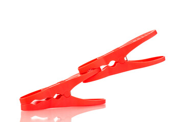 Two plastic clothespins, macro, isolated on a white background.