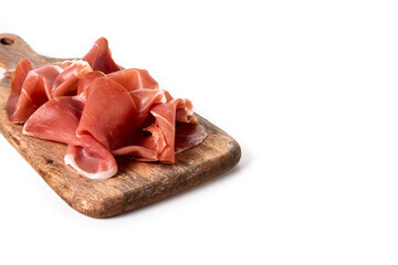 Spanish serrano ham on cutting board isolated on white background. Copy space