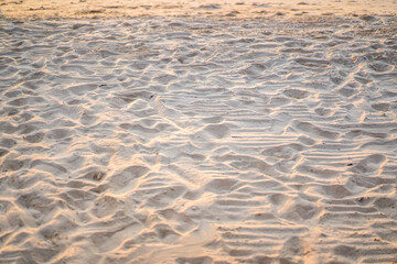 Sand on the beach for background. Brown beach sand texture as background. Sand texture background. Brown desert pattern from tropical beach. Close-up. Selective Focus
