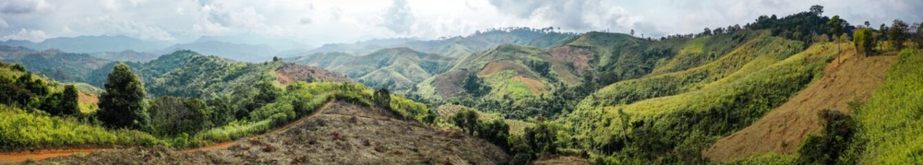 Naklejka premium Aerial view of Curvy road number 3 in the mountain of Pua district, Nan province, Thailand