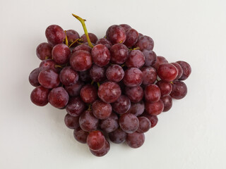bunch of red grapes on a white background