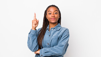 afro pretty woman feeling like a genius holding finger proudly up in the air after realizing a...
