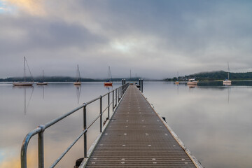 Fototapeta premium Boats and wharf on a foggy morning