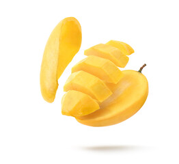 Ripe yellow Mango with slices levitate isolated on white background.