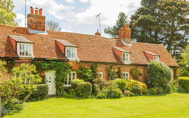 Row of old traditional English village cottages on a sunny day. Orford, Suffolk. UK