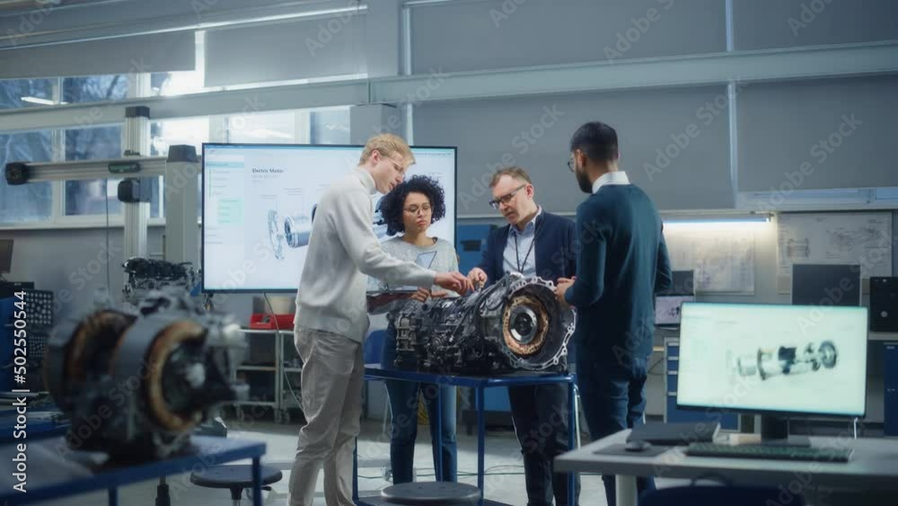Aufkleber Diverse Engineers Work Together on Modification of Functioning of Electric Engine for Innovative Project. Engineering and Sustainable Energy Concept. Slow Motion