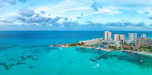 cancun resort with beach and birds
