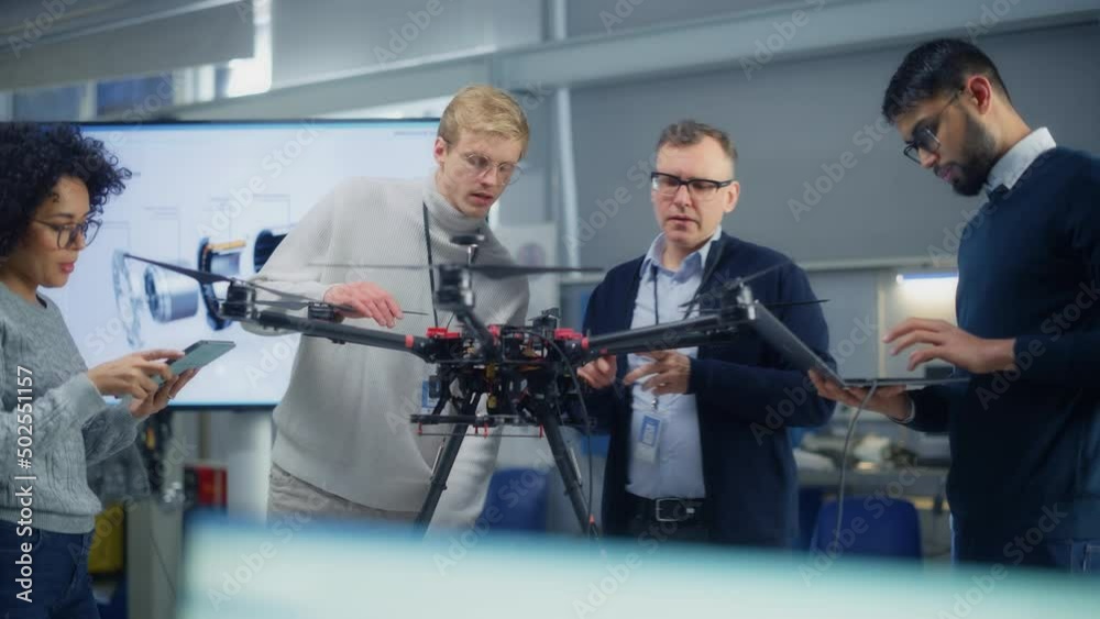 Poster enthusiastic diverse engineers have energetic discussion about drone design. smart people programs a