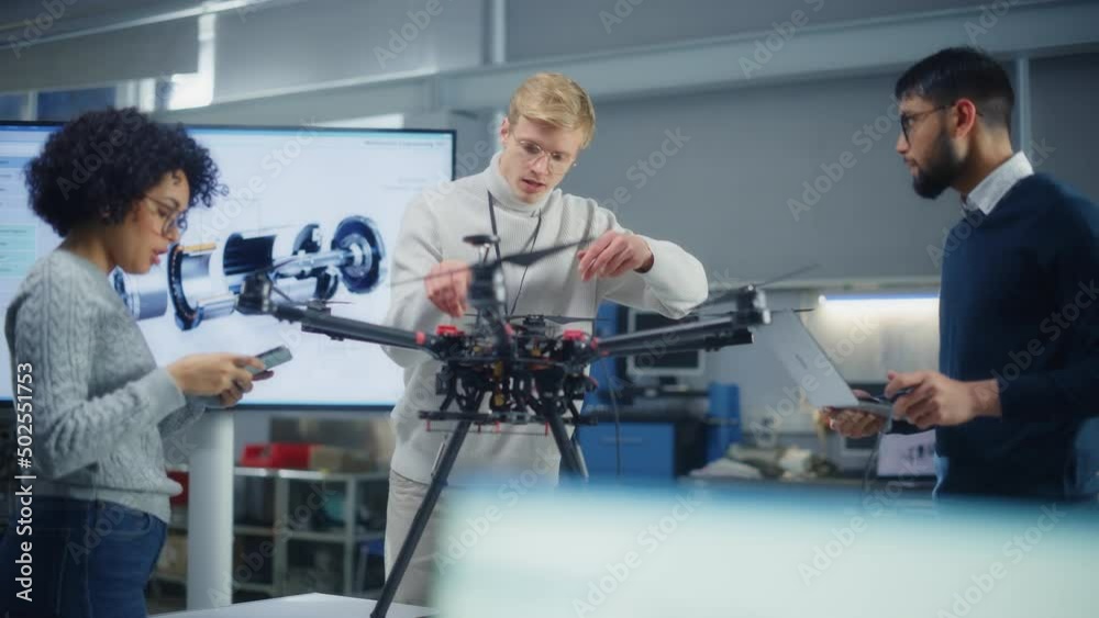 Aufkleber diverse aviation engineers building, sets up, configuring and testing drones while work at factory. 