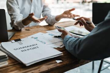 Businessman bookkeeper holding calculator for calculate financial data at meeting room, Business Financing Accounting Banking Concept