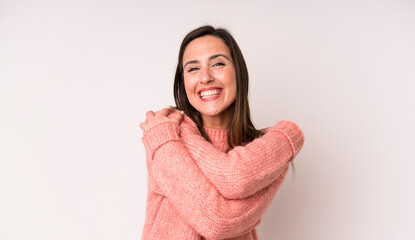 young adult pretty woman feeling in love, smiling, cuddling and hugging self, staying single, being...