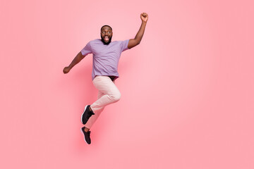 Fototapeta na wymiar Full length body size view of attractive cheery lucky guy jumping rejoicing isolated over pink pastel color background