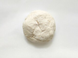 Fresh raw dough on white background. Top view. 