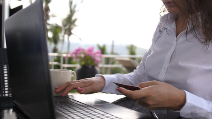 Woman typing number of credit card on laptop computer for buying online internet shopping concept modern technology comfortable lifestyle payment system. Security business woman