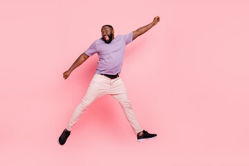 Fototapeta na wymiar Full length body size view of attractive cheerful crazy guy jumping having fun isolated over pink pastel color background