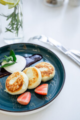 top view of proper breakfast, baked curd pancakes