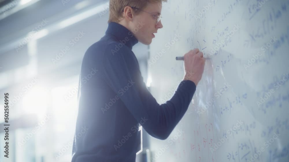 Poster Young Mathematician Approaches Whiteboard and Thinks about Solving Long and Complex Equation/ Formula. Genius Developing New Theories Concept. Portrait View