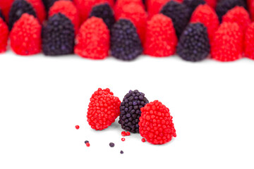 Marmalade raspberries and blackberries close-up, isolated on a white background