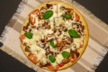 slices of fresh round pizza with mushrooms, vegetables, mushrooms and cheese top view