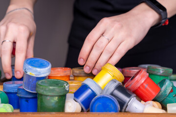gouache paints scattered on the table