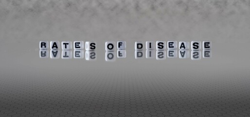 rates of disease word or concept represented by black and white letter cubes on a grey horizon...