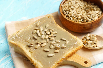 Organic sunflower seed butter spread on wheat bread. Selective focus.