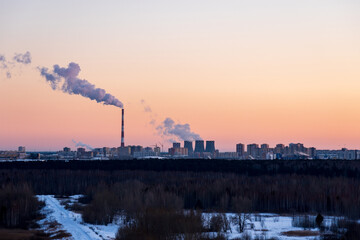Pollution of environment and air in cities. Smoking industrial zone factory chimneys.