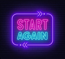 Start again neon sign on a brick background.