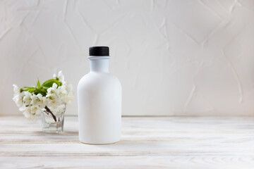 White bottle on a light background