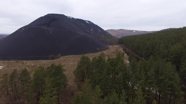 Aerial view of huge metallurgical black slag dumps